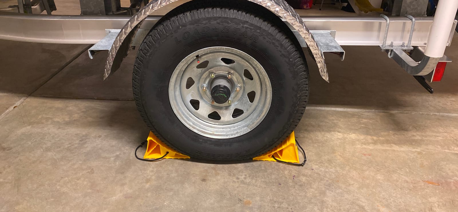 Camco Camper & RV Wheel Chock with Rope - Keeps Trailer in-Place to Safely Unhitch or Park - Compatible with Wheels Up to 26