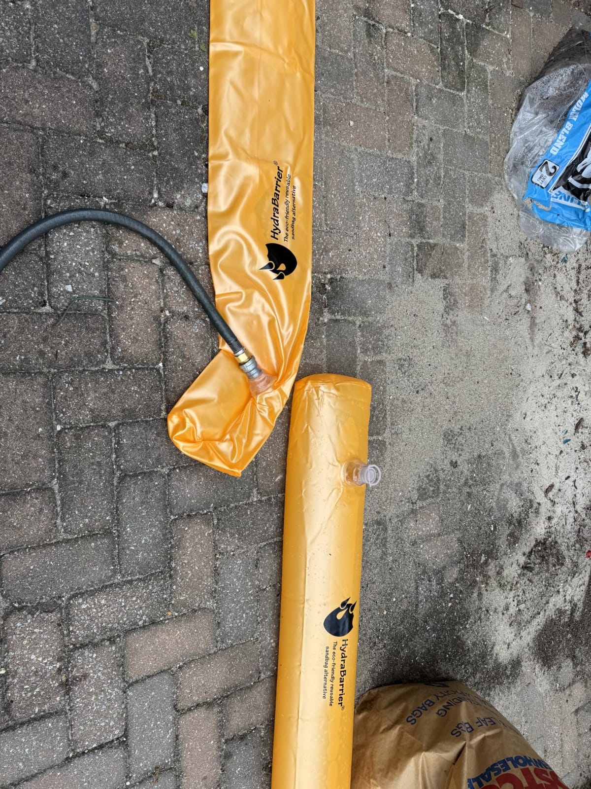 The Original HydraBarrier Standard Flood Barrier – 6 ft Long x 4 in High – Light, Reusable Sandbag Alternative – Flood Control & Diversion Tube for Home, Garage, Door & Property Protection customer photo 1