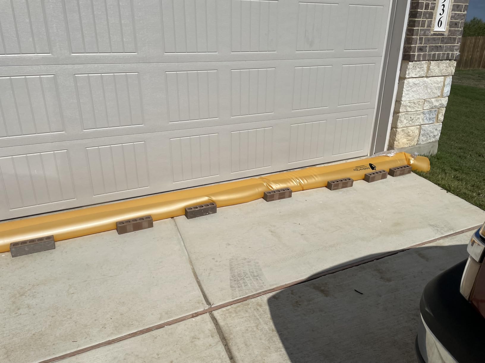 The Original HydraBarrier Ultra Flood Barrier – 12 ft Long x 6 in High – Light, Reusable Sandbag Alternative – Flood Control & Diversion Tube for Home, Garage, Door & Property Protection customer photo 1