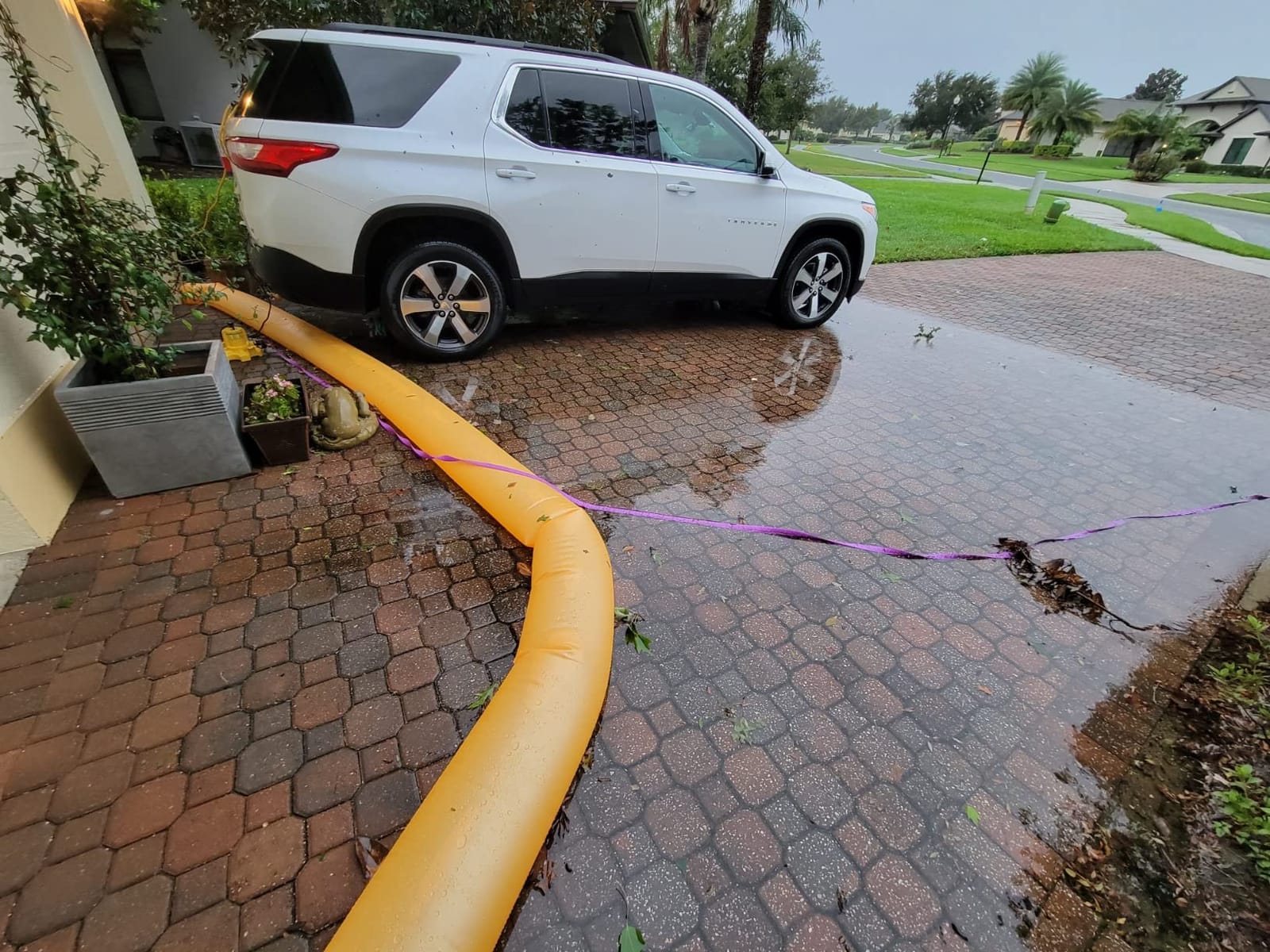 The Original HydraBarrier Ultra Flood Barrier – 12 ft Long x 6 in High – Light, Reusable Sandbag Alternative – Flood Control & Diversion Tube for Home, Garage, Door & Property Protection customer photo 2