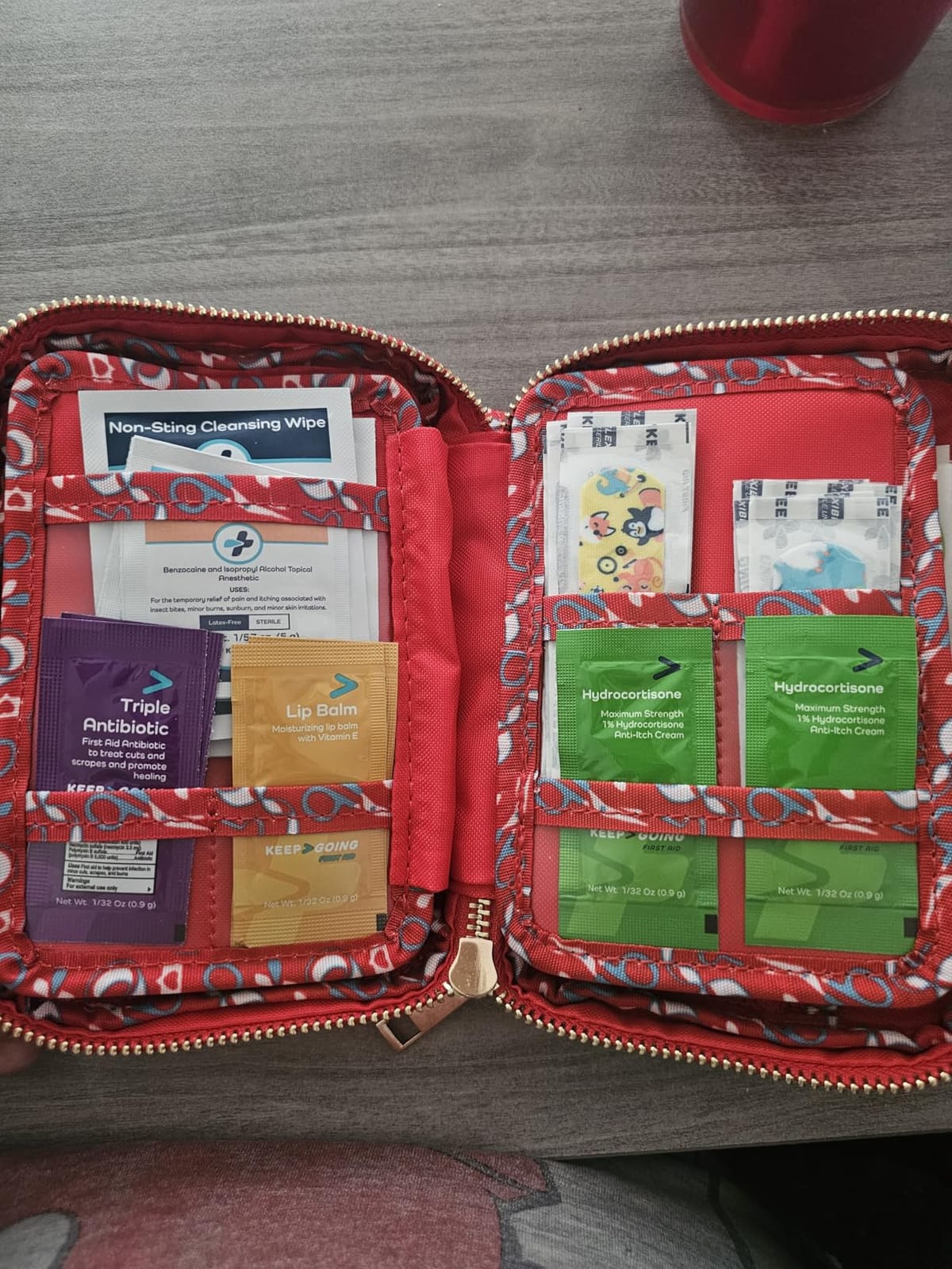 Keep Going Travel First Aid Kit for Kids – 130 Pc.for Purse, Diaper Bag, Backpack, & Suitcase, with Latex-Free Bandages – 7 x 5 x 2 in. Travel First Aid Kit TSA-Approved customer photo 1